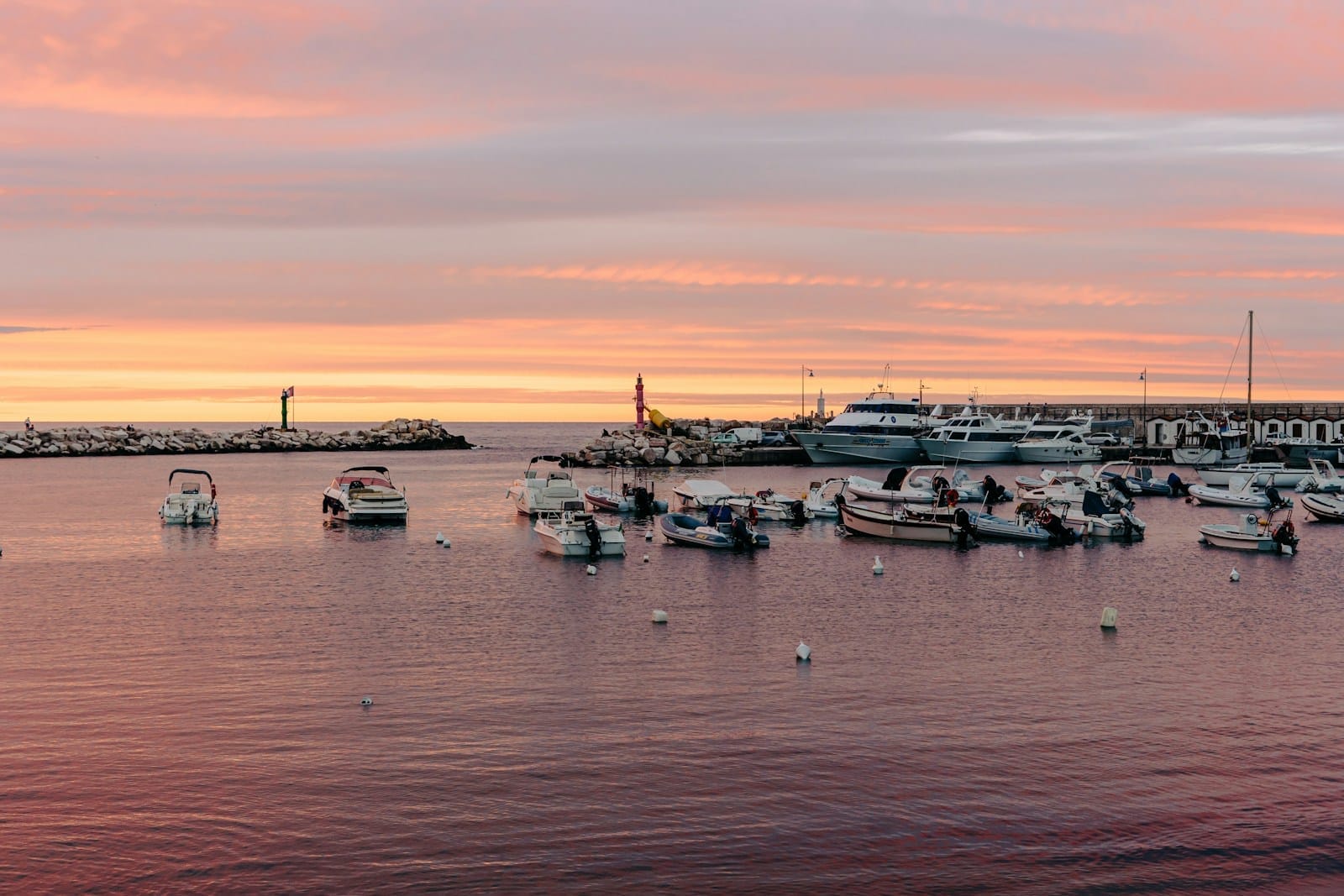 white and black boats on sea during daytime