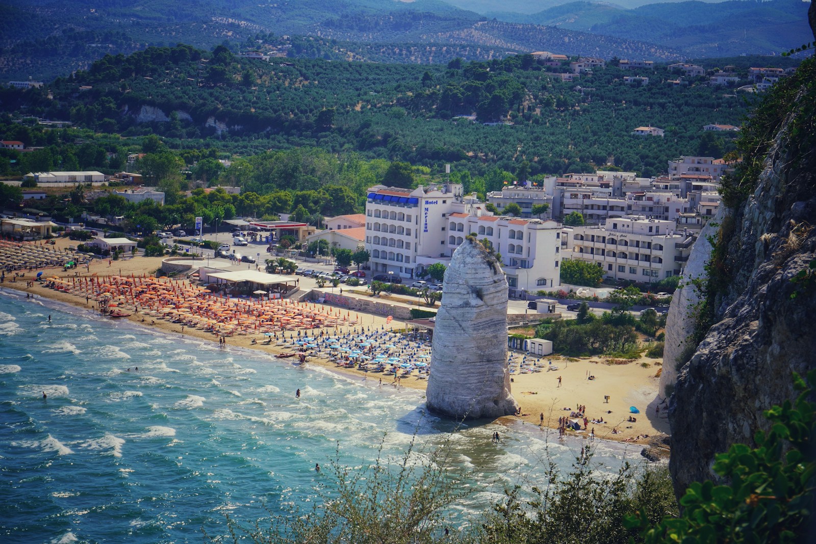 a view of a beach from a cliff